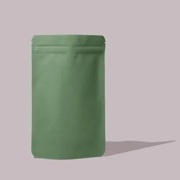 Green cardboard packaging for tea. Stock Photos
