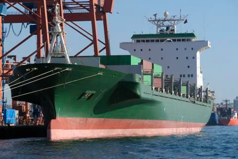 Green Cargo Container Ship at Dock Stock Photos