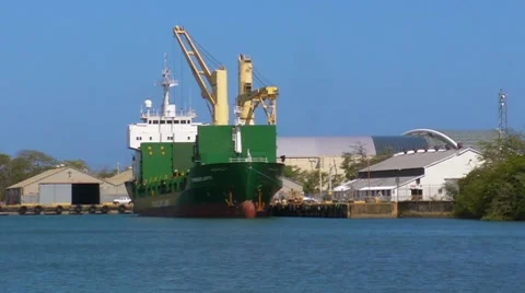 Green Cargo Ship in Dock Stock Footage 7746877