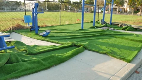 Green carpet for blue exercise equipment washed and  pulled out of the ground af Stock Footage 288214646