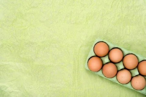 Green carton of different eggs. Easter background Stock Photos