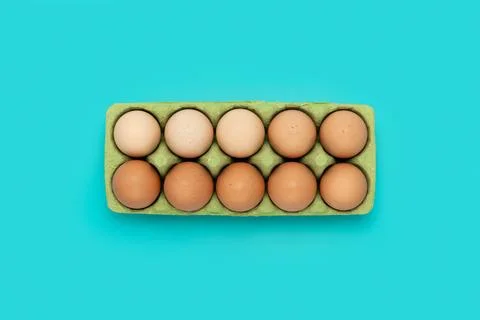 Green carton of different eggs. Easter background Stock Photos