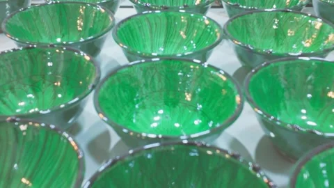 Green Ceramic Bowls in Rows, Handmade Pottery Tableware Background Stock Footage 328626474