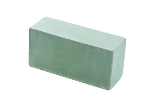 Green ceramic brick at the white background, isolated Stock Photos