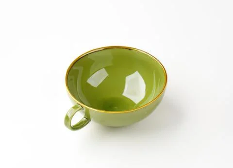 Green ceramic cup with handle on plain background Photos