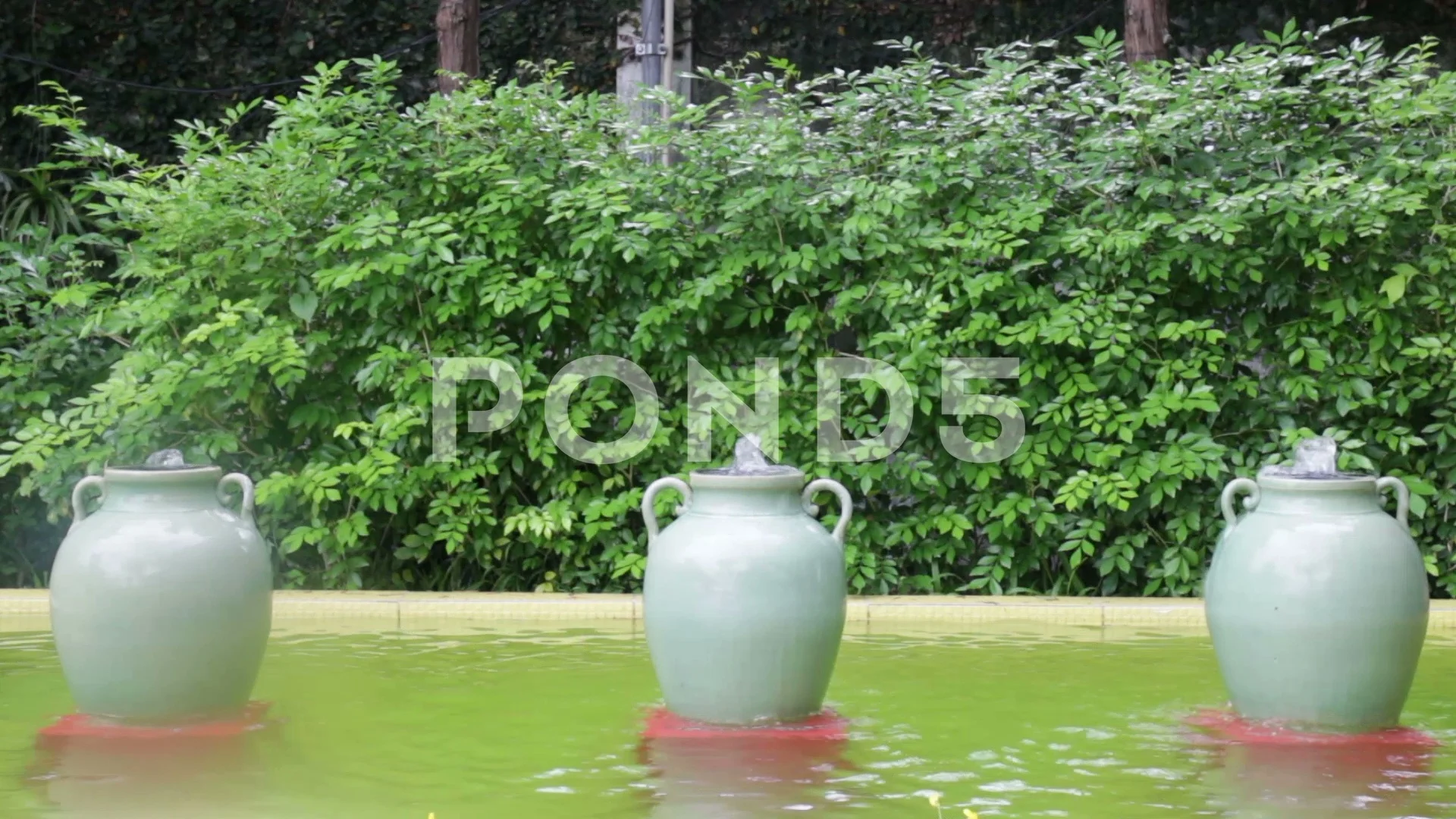 Green Ceramic Jar Fountain Decorated In Garden Footage 77258583