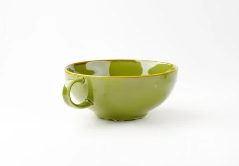 Green ceramic mug with handle on white background Photos