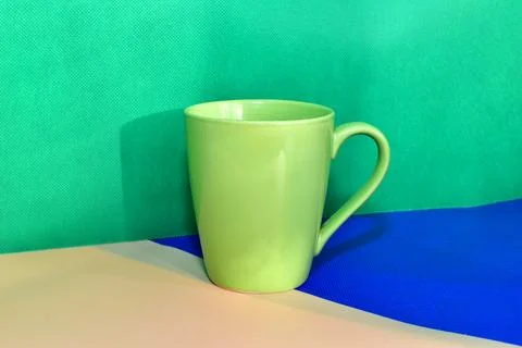 Green ceramic mug. Stock Photos