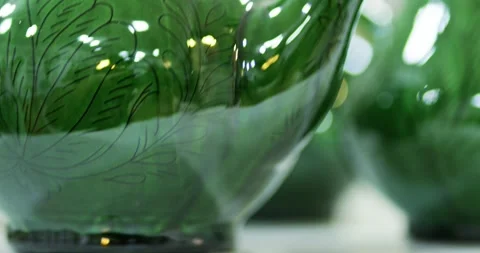 Green Ceramic Teapot Set on Table with Soft Bokeh Background Stock Footage 336963202