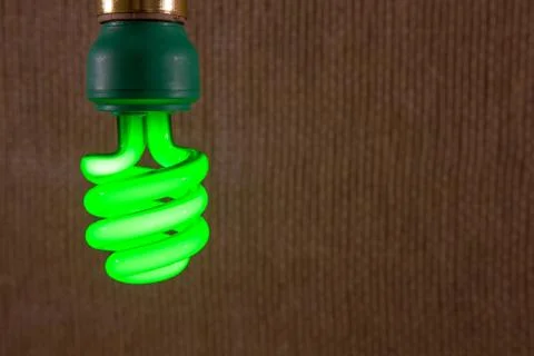 Green cfl light bulb close-up Stock Photos