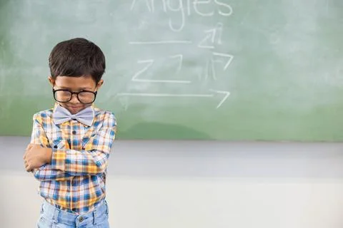 Green chalkboard displaying cursive Angles heading in classroom, with drawn Stock Photos