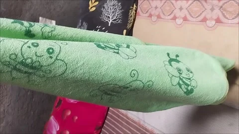 Green character towel Stock Footage 293115416