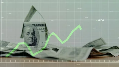 Green chart emerging left, tracing peaks, rising over folded USD house, showing 動画素材 332405197