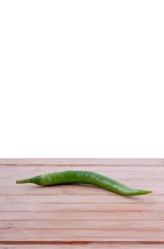 Green chilli chopping board Stock Photos