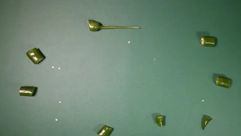 Green chilli pepper on green background cut pieces move rotate slide to whole Stock Footage 157648163