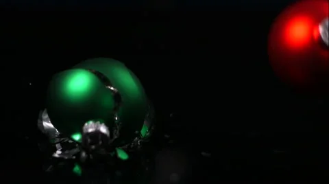 Green Christmas Ornament Shatters, Red Ornament Bounces In Slow Motion Stock Footage 59669224