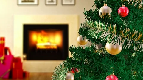 Green Christmas tree next to burning fireplace and gift boxes at living room Video stock 100200620