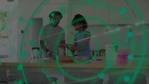 Green circle moving and initiating couple slicing bread and pouring into blender Stock Footage 333368708