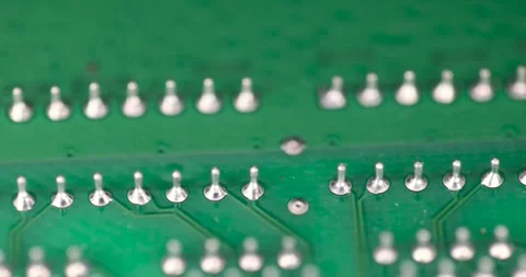 A green circuit board with a large number of contacts, a simple green printed Video stock 313850331