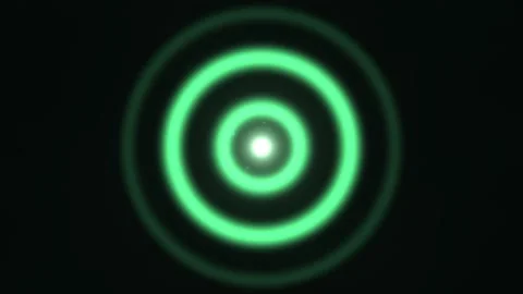 Green circular light patterns in a dark space create Stock Footage 338413185
