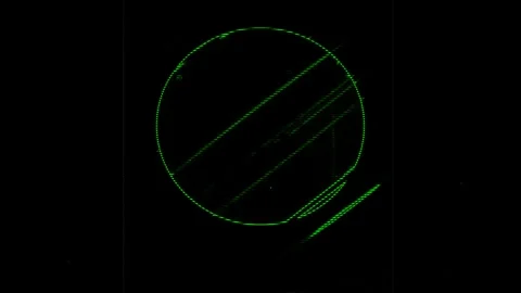 Green circular pattern with diagonal lines on a black background Video stock 283973265