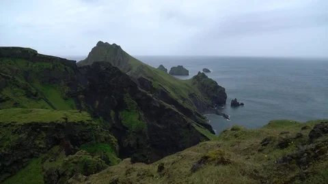 Green cliffs and ocean overlook - Vestmannaeyjar Island Video stock 72326180