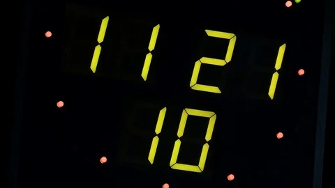 Green clock with an electronic scoreboard Stock Footage 69826116