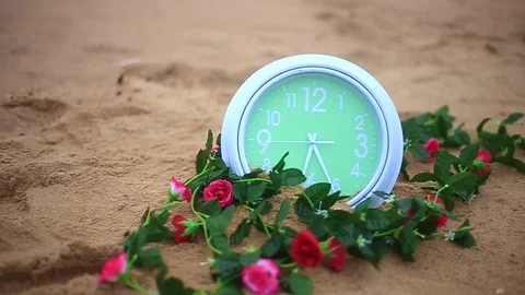 Green clock on sandy Stock Footage 94018026