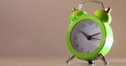 Green The clock sets the time to 10.00. on white background 4k. Stock Footage 300364486