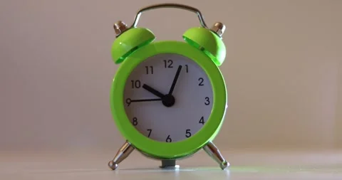 Green The clock sets the time to 10.00. on white background 4k. Stock-Footage 300364567