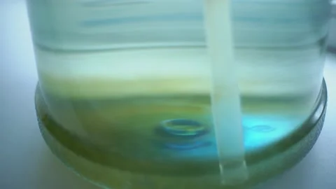 Green coating on the bottom of a large, 19 liter bottle for drinking water Vídeo Stock 239610826