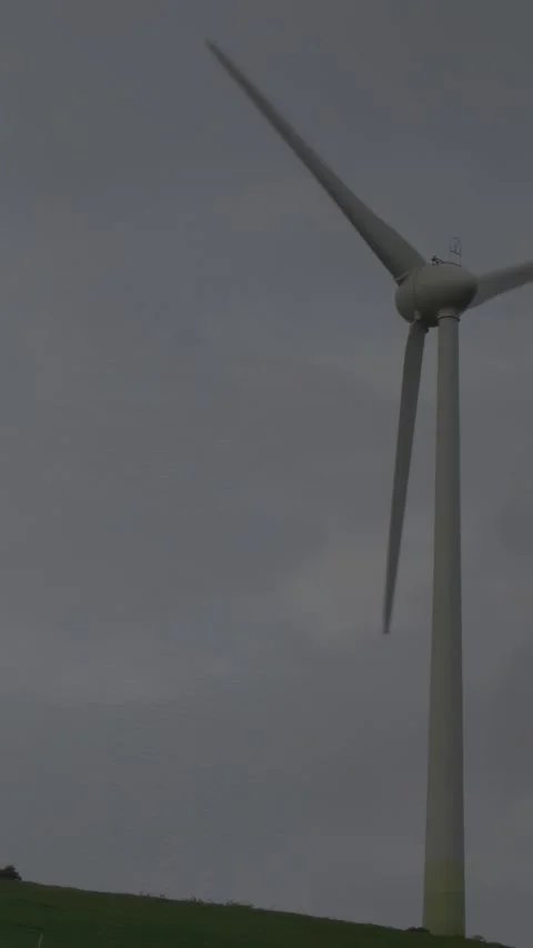 Green code appearing across grey sky causing turbine sliding and blades spinning Stock Footage 330395240