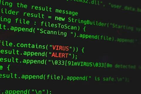 Green code line with Virus Alert words on screen. Security online concept Stock Photos