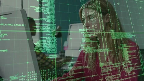 Green code overlay appearing over coworkers typing at desks and emphasizing Stock Footage 328252266