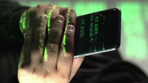 Green code text rolls over smartphone in hand, vertical close-up 스톡 동영상 236917920