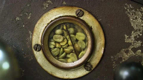 Green coffee beans in roaster window, close-up coffee production shot, Ecuador. Stock Footage 277532135