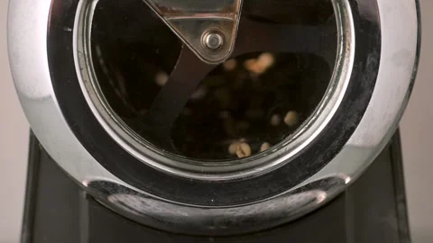 Green Coffee Beans Rotating in Home Roaster in Slow Motion Stock Footage 247660785