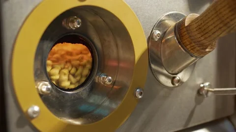 Green coffee roasting in a roasting machine Stock Footage 143869336