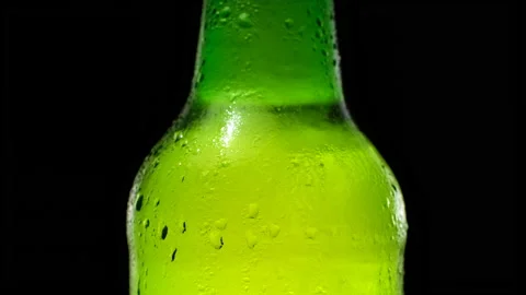 Green cold bottle with beer. Bottle with waterdrops and condensate. Stock Footage 155686370