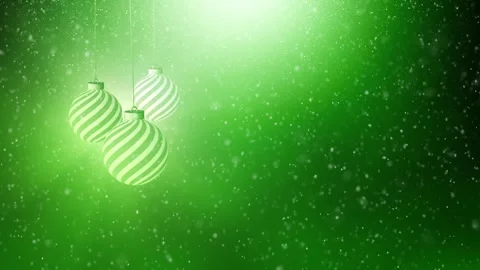Green colored christmas baubles swing with looping snowfall background Stock Footage 346649367