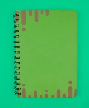 Green colored note paper diary placed on top of a light blue paper background Stock Photos