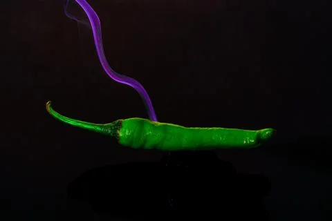 Green colour chilli with  black background Stock Photos