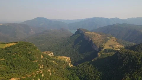 Green colourful river between mountain and small church on the hill Stock Footage 119398081