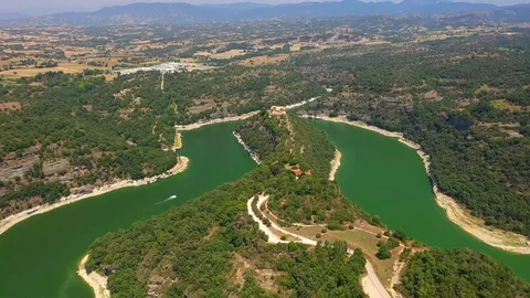 Green colourful river between mountain and small church on the hill Stock Footage 119398110