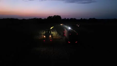 Green combine chopping corn silage in Ukraine at night 스톡 동영상 298058922