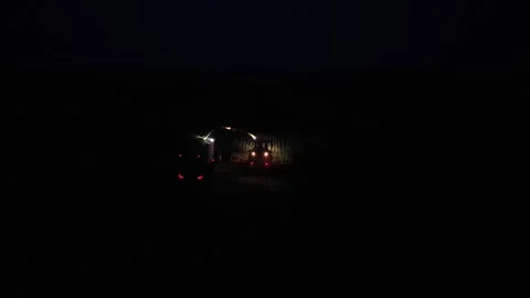 Green combine chopping corn silage in Ukraine at night 스톡 동영상 298059159
