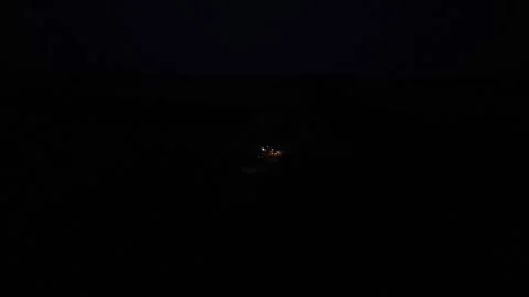 Green combine chopping corn silage in Ukraine at night Video stock 298068145