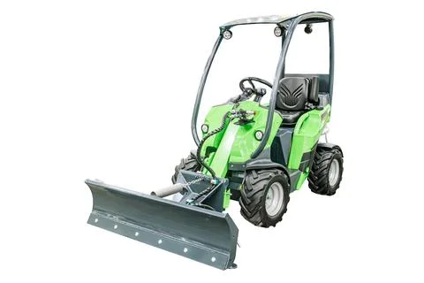 Green compact track loader on transparent background, equipped with cab enc.. Stock Photos