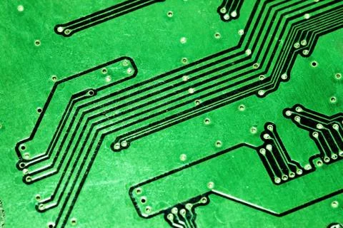 Green computer board with chips and components. Stock Photos