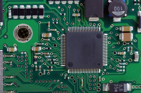 Green computer board with chips and components. Stock Photos